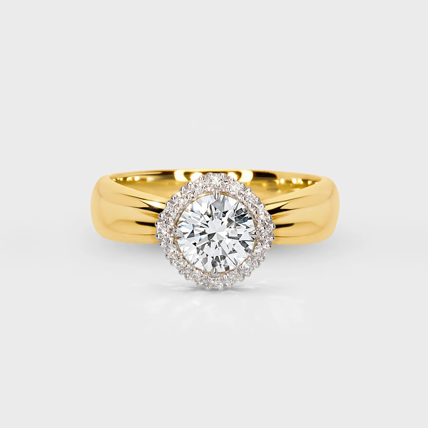 Halo yellow gold ring by ValeOro with a round diamond framed by a white gold halo of small diamonds, front view