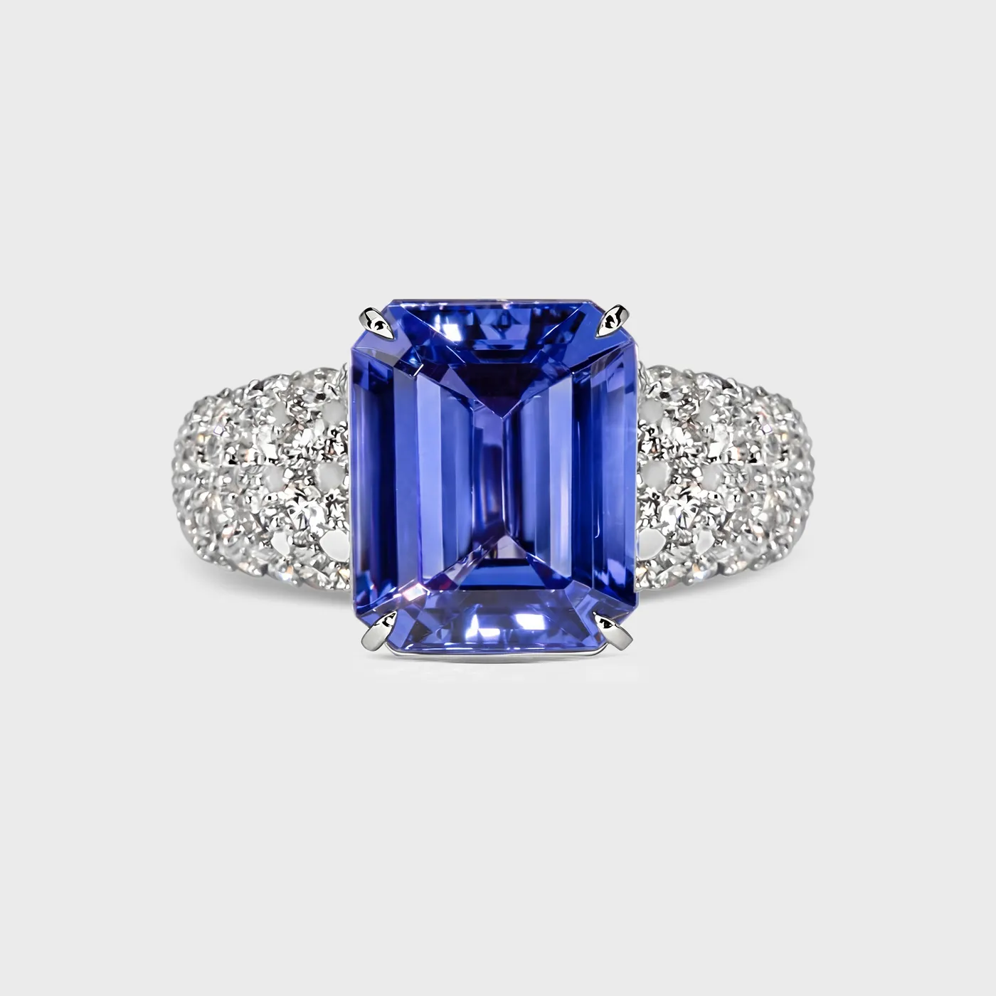 Sorteny Tanzanite white gold ring by ValeOro with an emerald-cut blue-violet tanzanite and diamond shoulders, front view