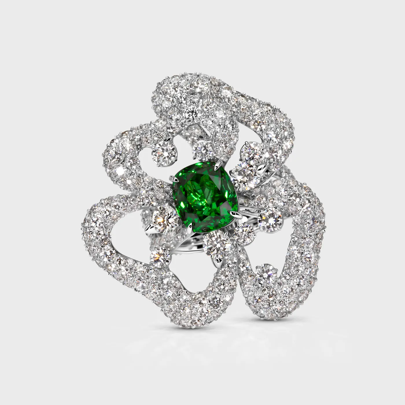 Protea Tsavorite white gold ring by ValeOro with a green cushion-cut tsavorite framed by openwork diamond petals, front view