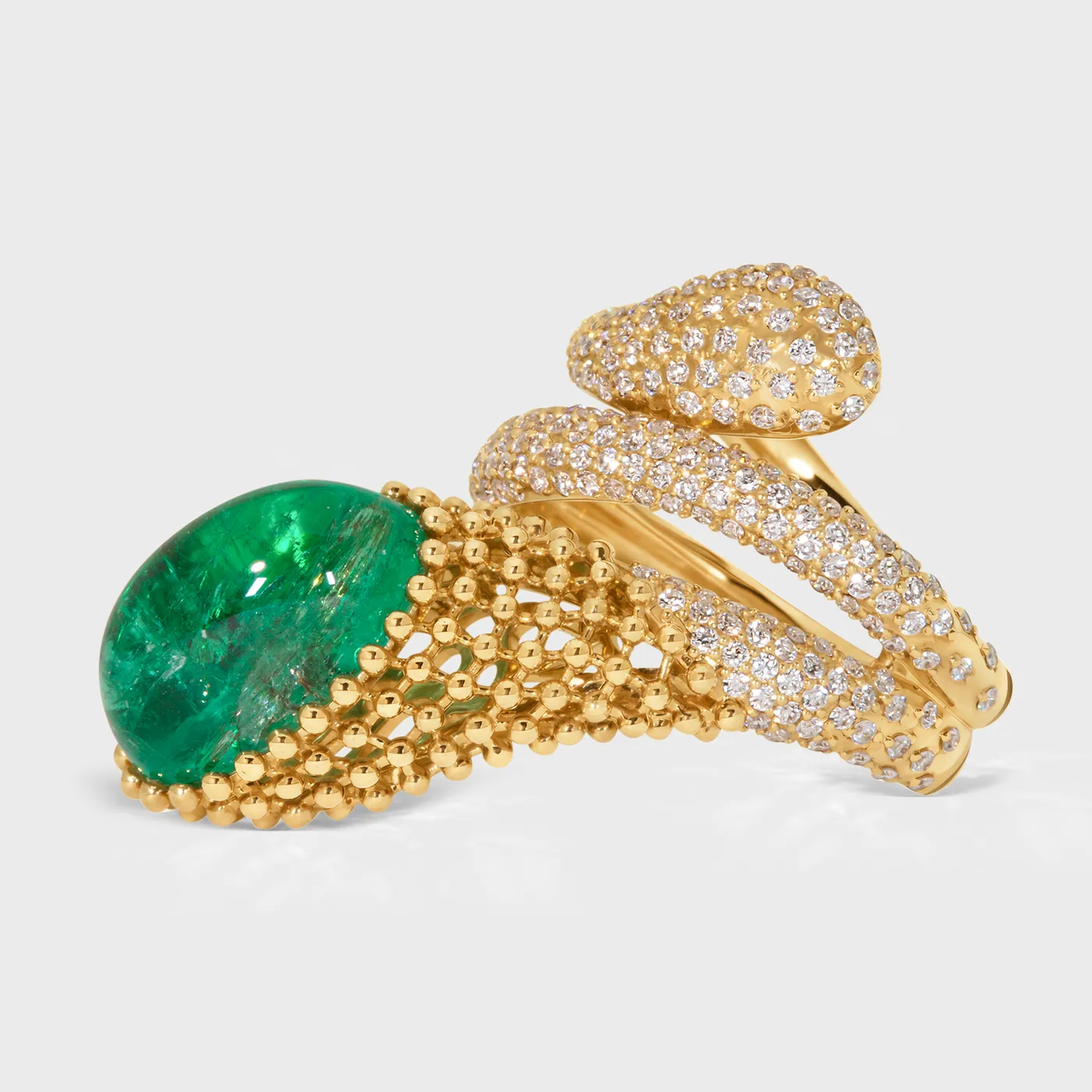 Le Mans yellow gold ring by ValeOro with a green emerald cabochon and a diamond-set serpent coil, side view