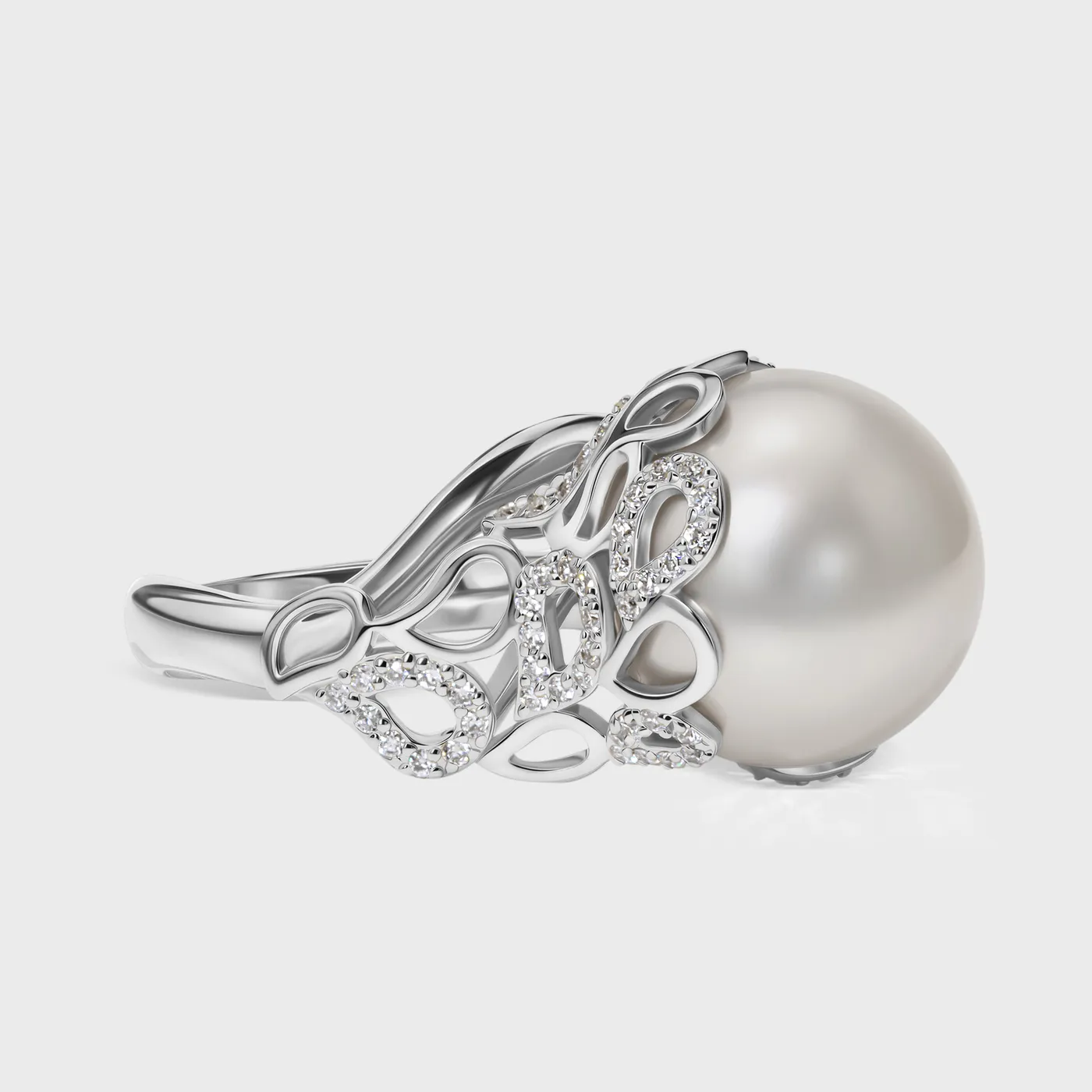 Rangiroa White ring by ValeOro in white gold with a round white pearl framed by openwork diamond scrollwork, side view
