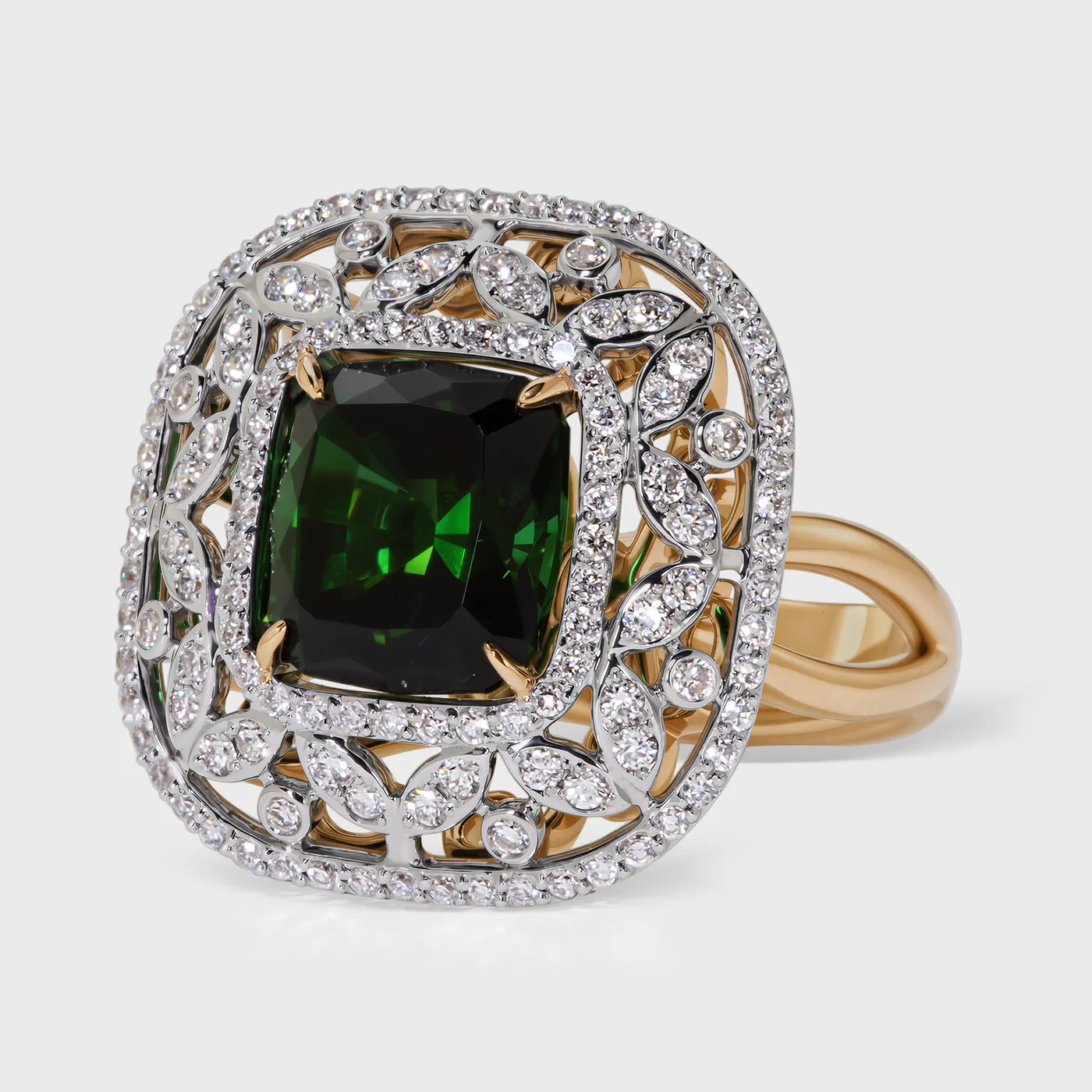 Olivia white gold ring by ValeOro with a green tourmaline in an openwork leaf-motif diamond frame, three-quarter view