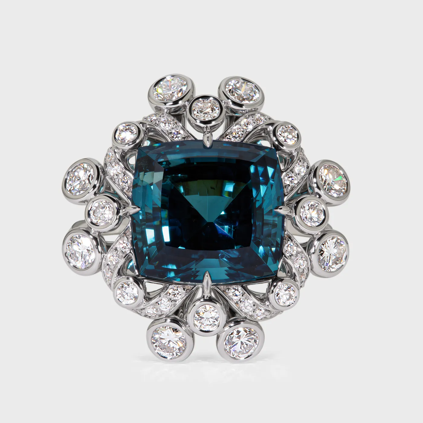 Genova white gold ring by ValeOro with a blue-green tourmaline framed by bezel-set diamonds, three-quarter view