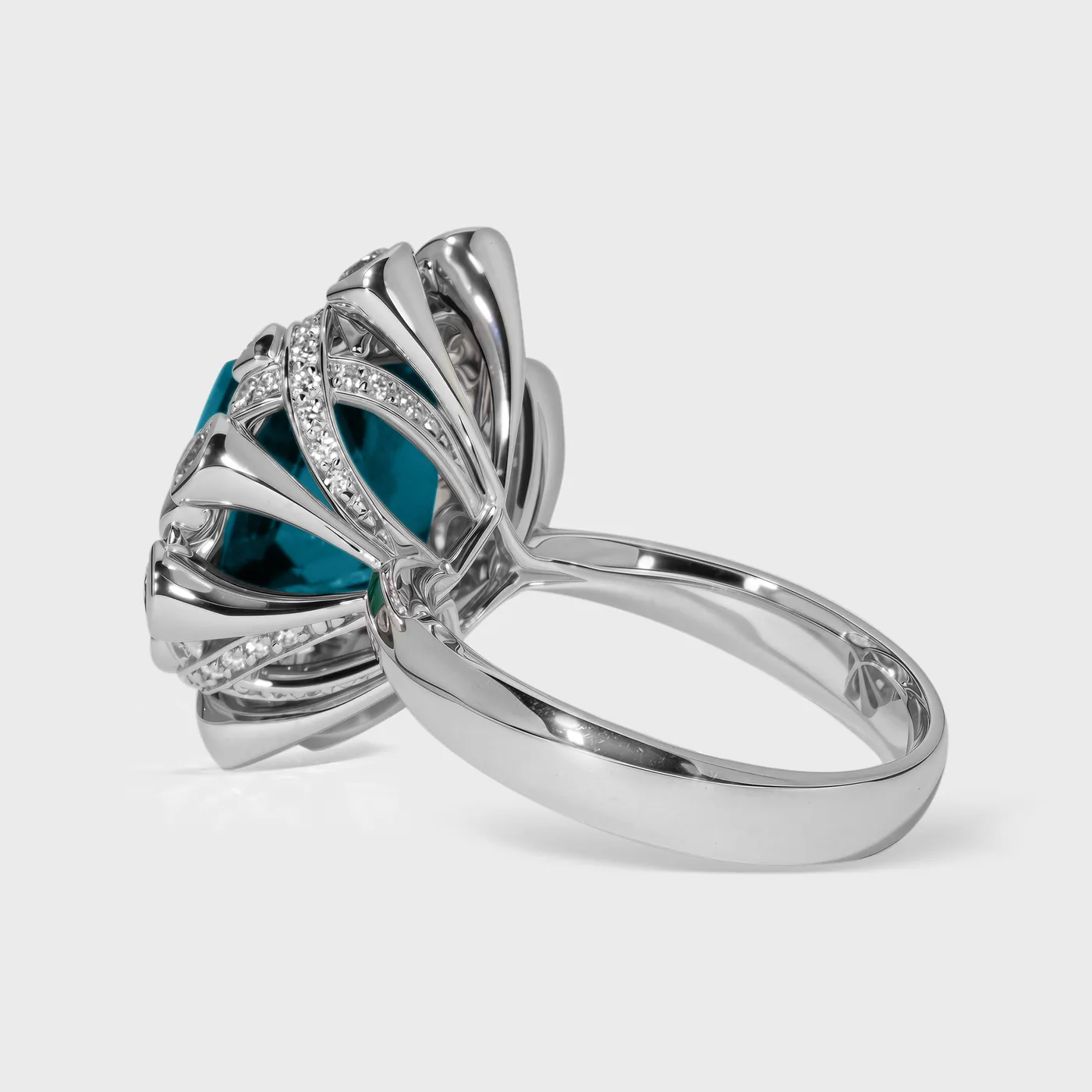 Genova white gold ring by ValeOro with a raised cushion-cut tourmaline and pavé-set diamond rays, side profile