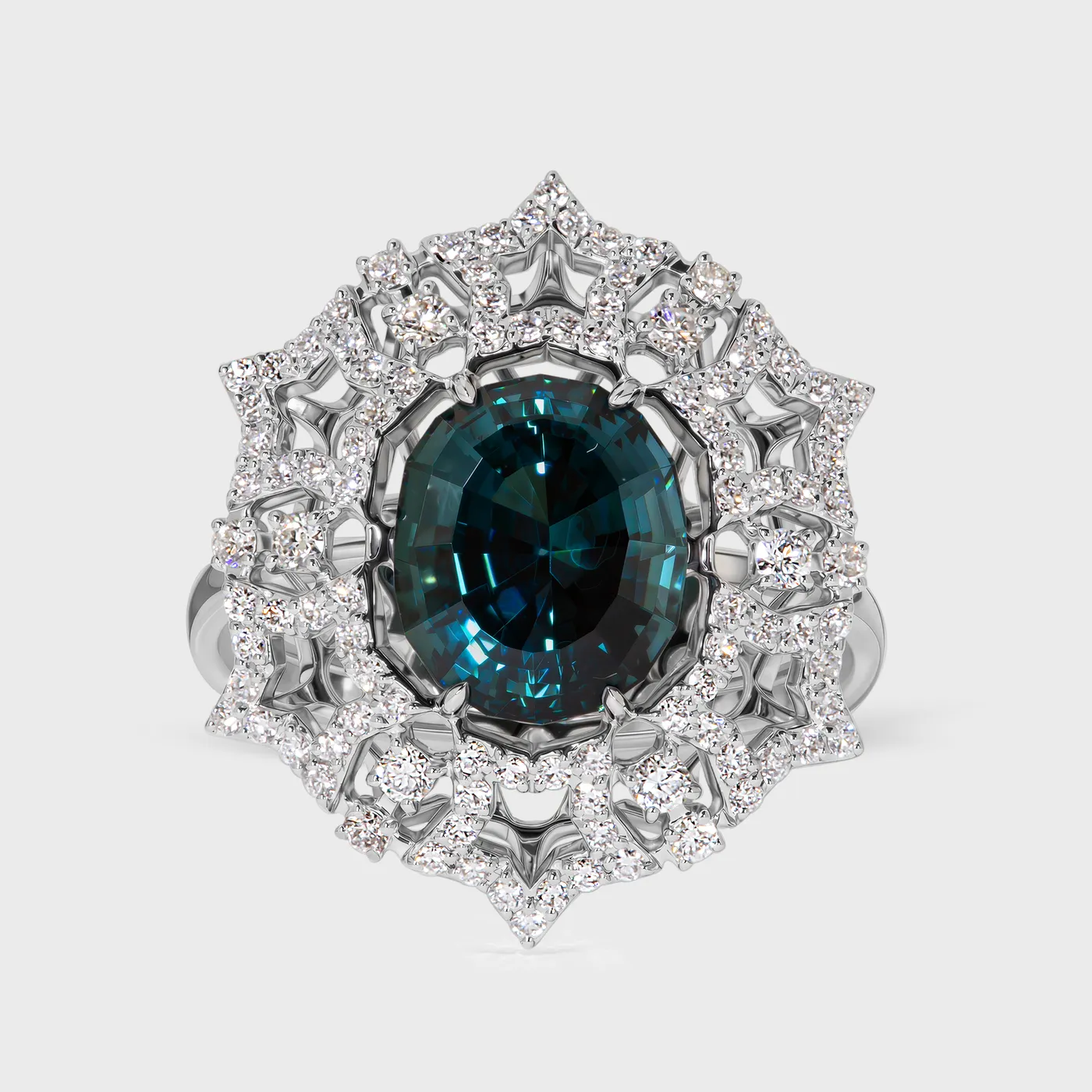Gemstones Star white gold ring by ValeOro with an oval blue-green tourmaline in a star-shaped diamond halo, front view