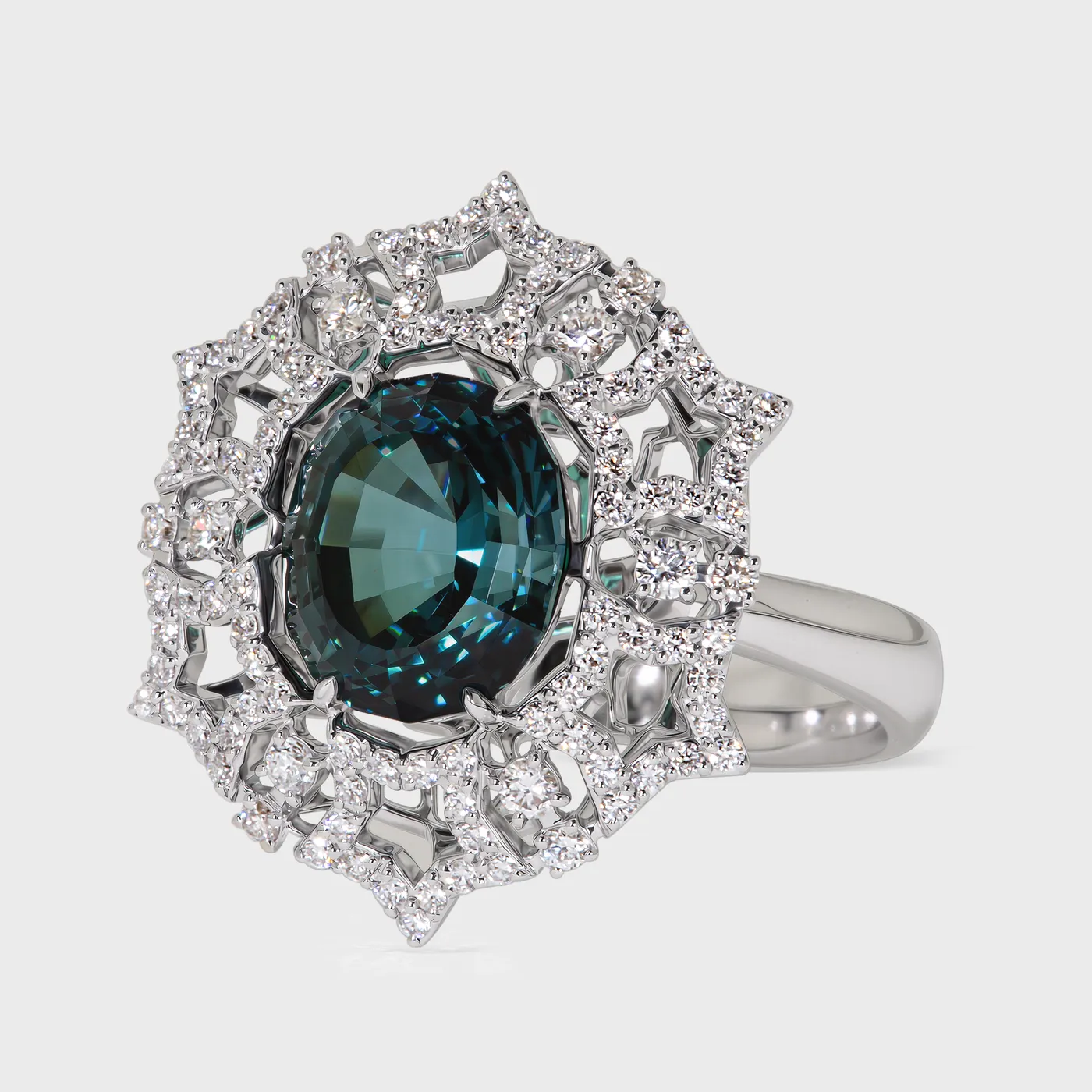 Gemstones Star white gold ring by ValeOro with an oval teal tourmaline in a star-shaped diamond halo, three-quarter view