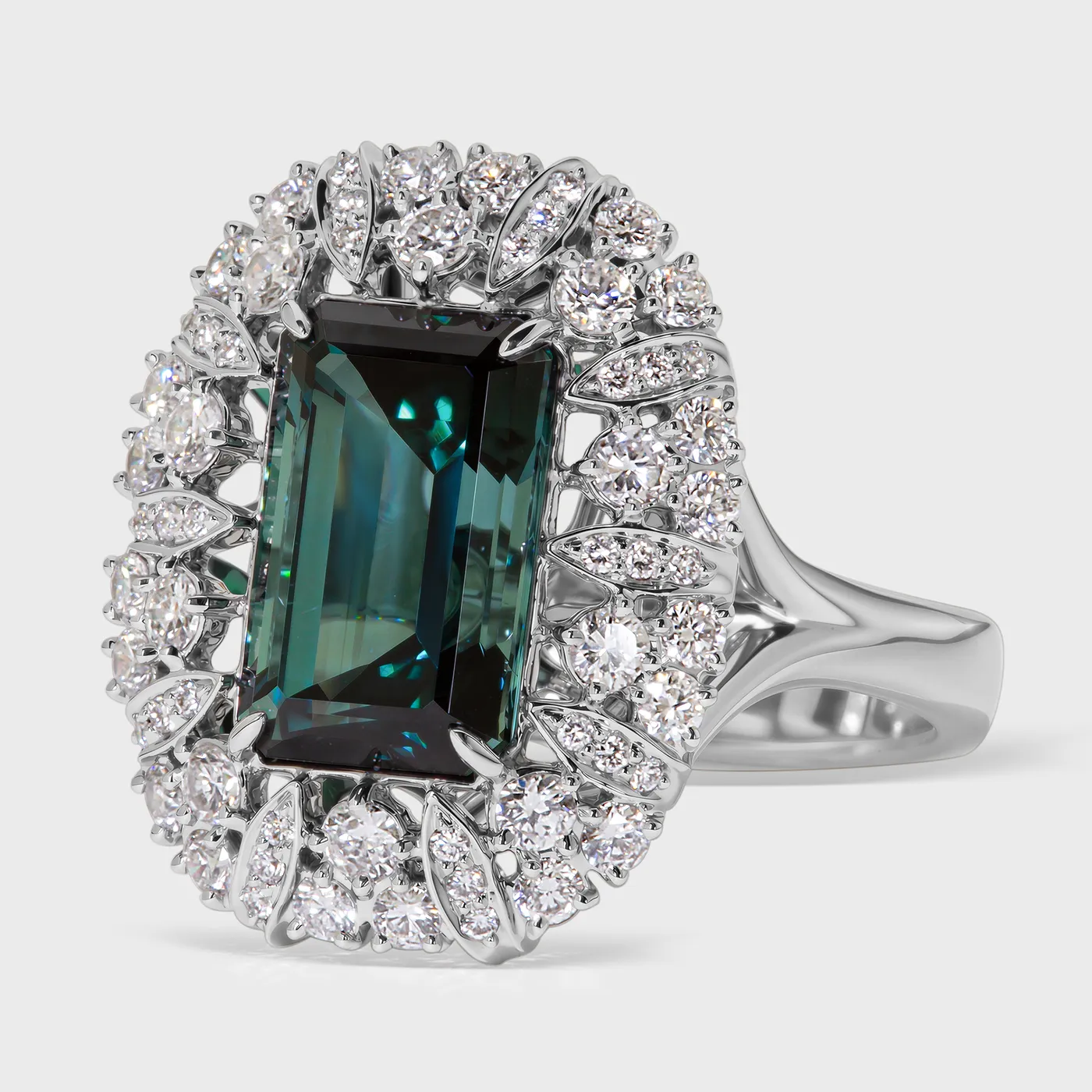 Cinquale white gold ring by ValeOro with a blue-green tourmaline in a leaf-shaped diamond halo, three-quarter view