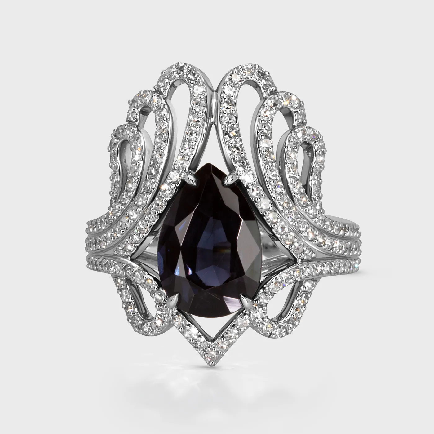 Regalia white gold ring by ValeOro with a pear-shaped blue spinel set in an openwork diamond crown, front view