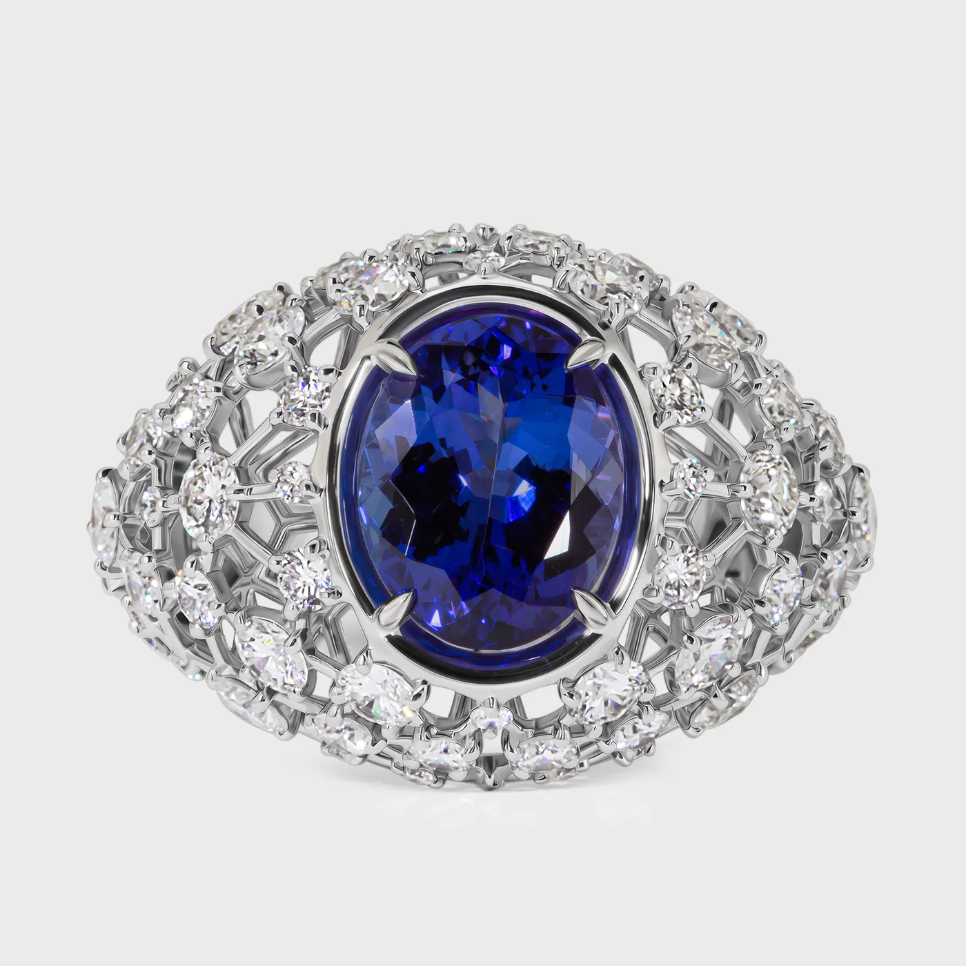 Venezia white gold ring by ValeOro with an oval blue-violet tanzanite in a domed openwork diamond setting, front view