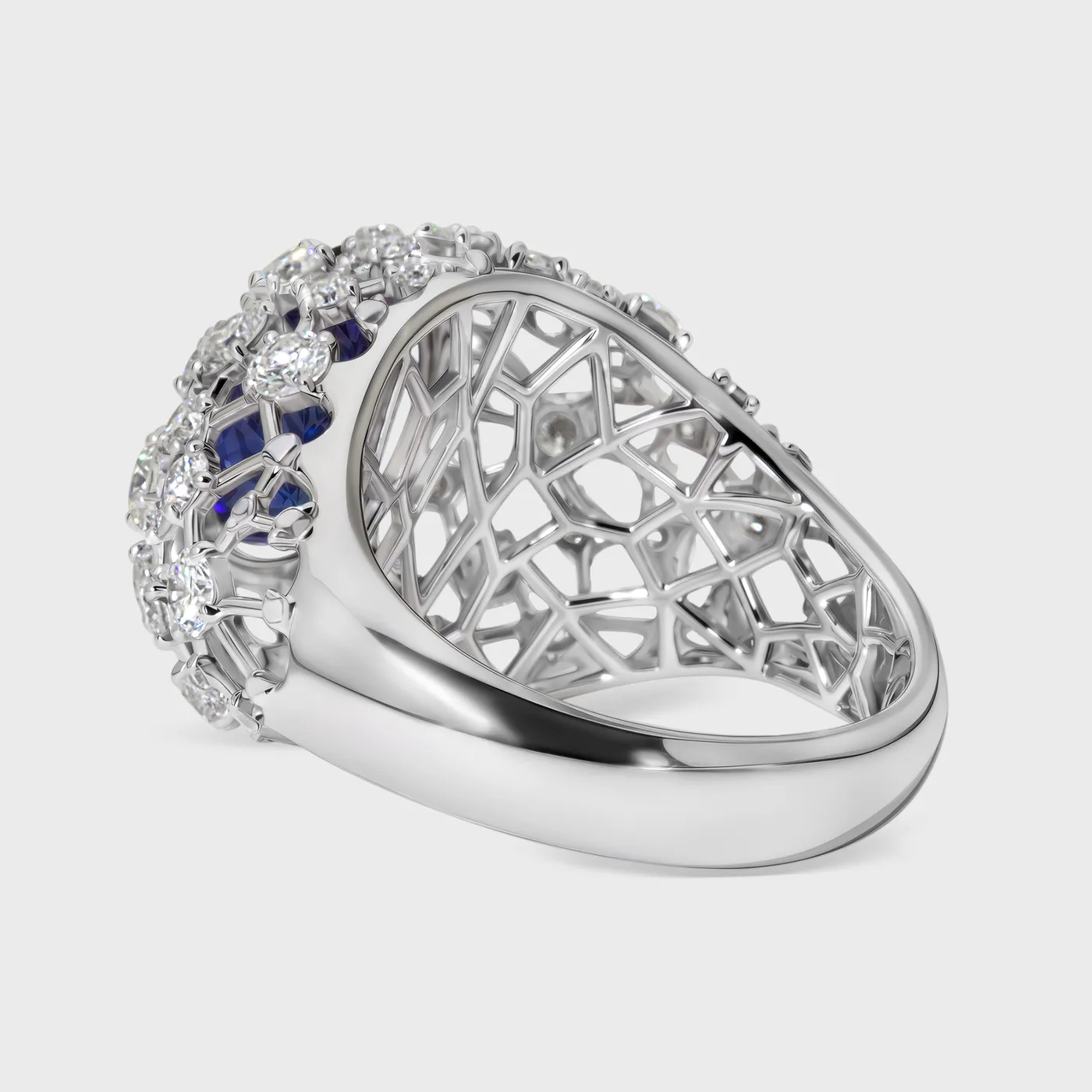 Venezia white gold ring by ValeOro with an oval blue-violet tanzanite on a diamond-scattered openwork dome, side view