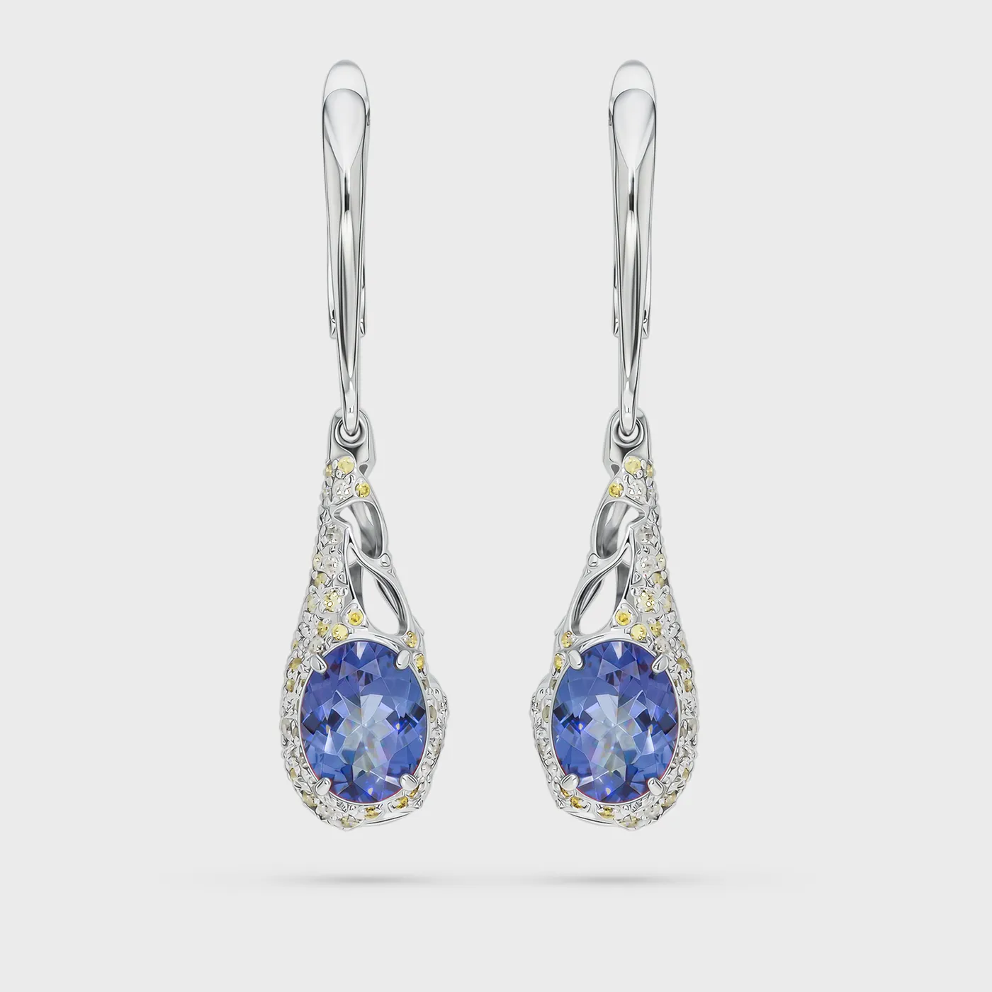 Cabo da Roca white gold earrings by ValeOro with oval blue-violet tanzanites in a white and yellow diamond halo, front view