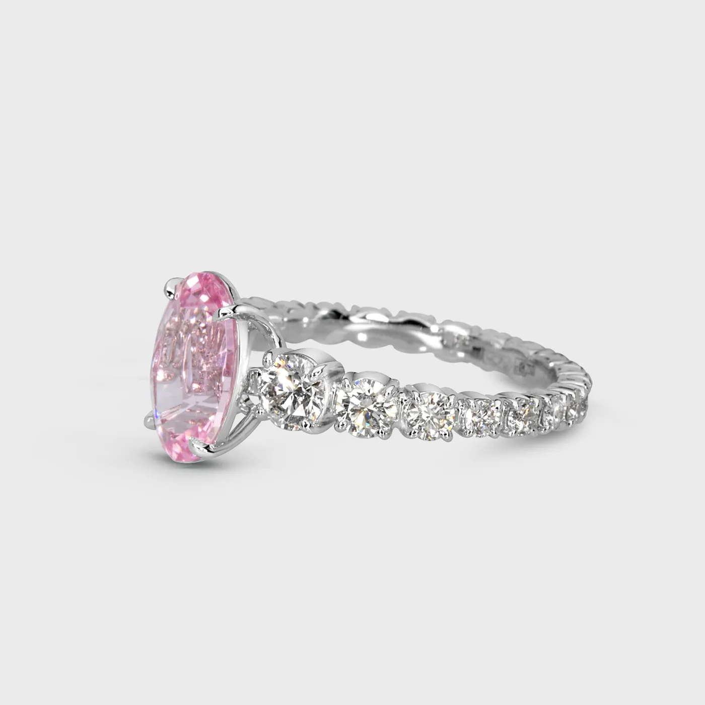 Roselie white gold ring by ValeOro with a pink morganite and graduated diamonds along the band, three-quarter view