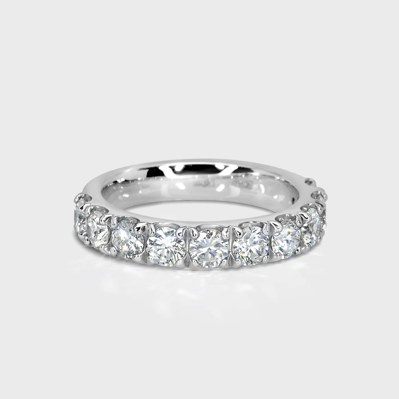 Gloss white gold ring by ValeOro with a line of round brilliant diamonds, front view