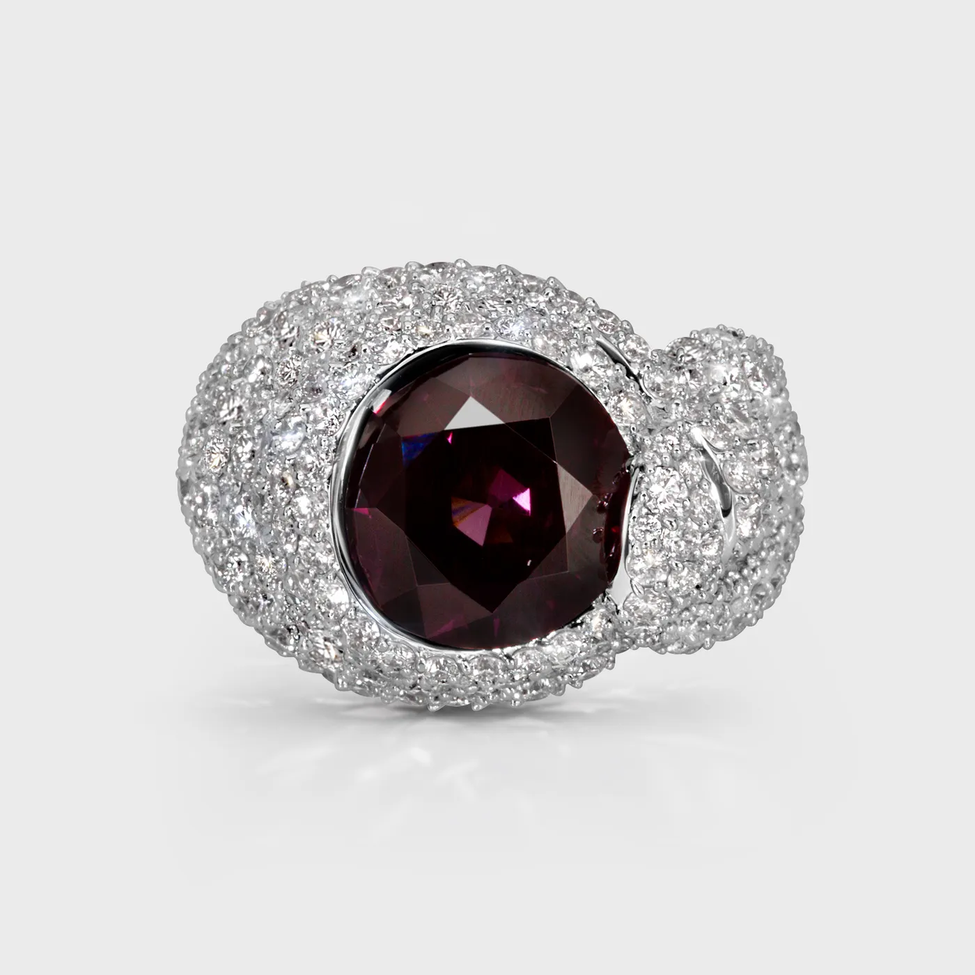 Liaison white gold ring by ValeOro with a round purple spinel set in a diamond bow, front view