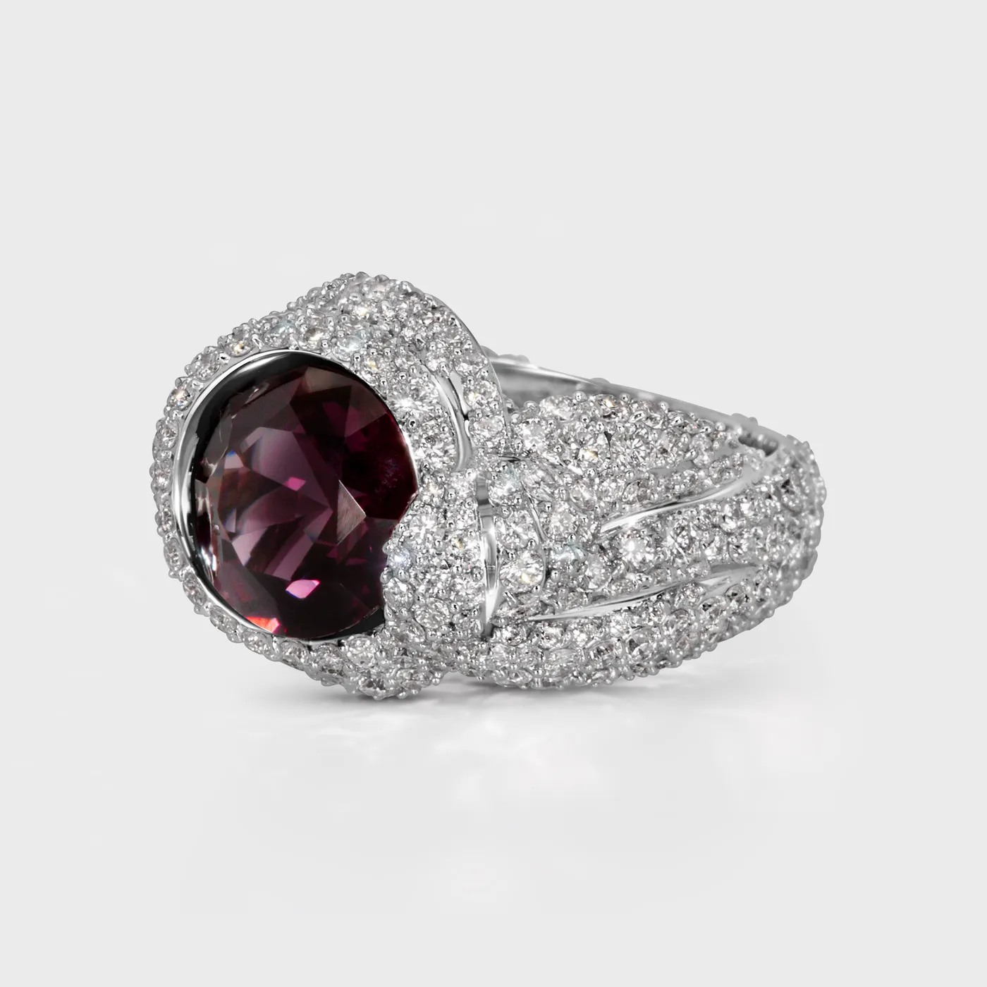 Liaison white gold ring by ValeOro with a round purple spinel and pavé diamond shoulders, three-quarter view