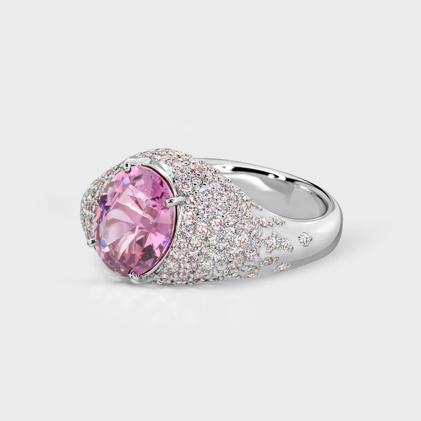 Cabo da Roca white gold ring by ValeOro with an oval pink spinel and diamonds scattered along the shank, three-quarter view