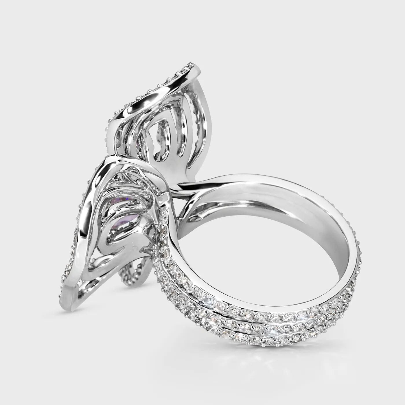 Moraea white gold ring by ValeOro with the openwork flower in profile and a diamond-set band, side view