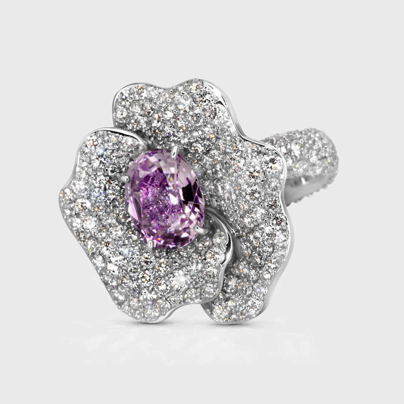 Hermanus white gold flower ring by ValeOro with a violet spinel and pavé diamond petals, three-quarter view