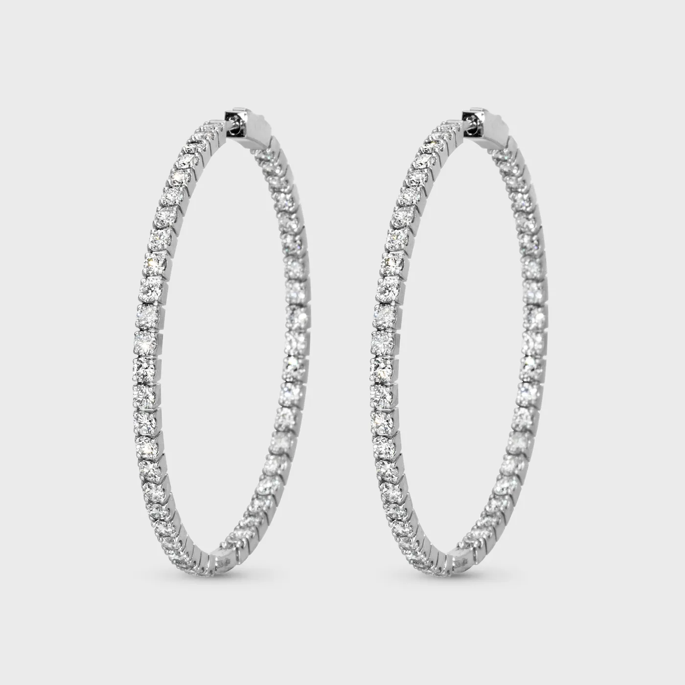 Mishel white gold hoop earrings by ValeOro with diamonds set on both the inside and outside, front view