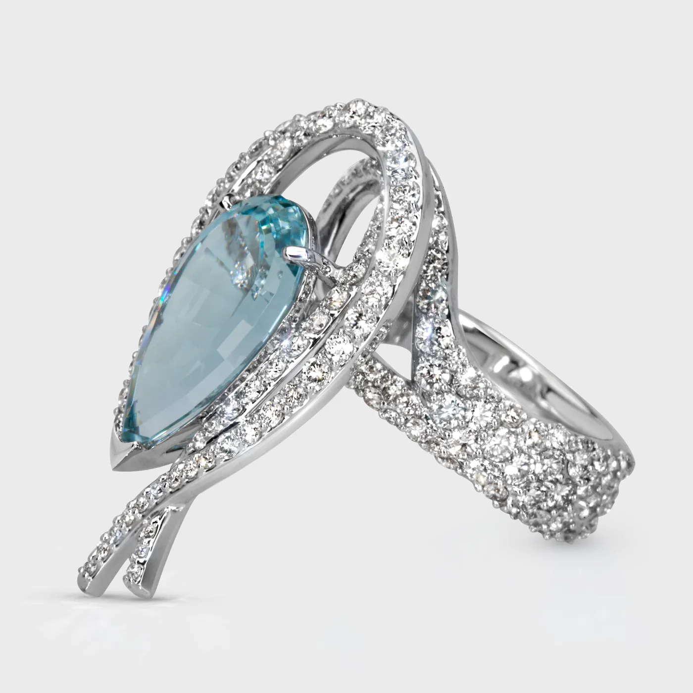 Vermont white gold ring by ValeOro with a light blue aquamarine and a pavé diamond band, three-quarter view