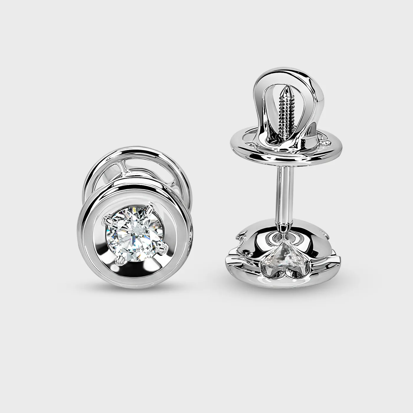 Heart white gold stud earrings by ValeOro with round diamonds, screw backs and heart-shaped side detail, side view