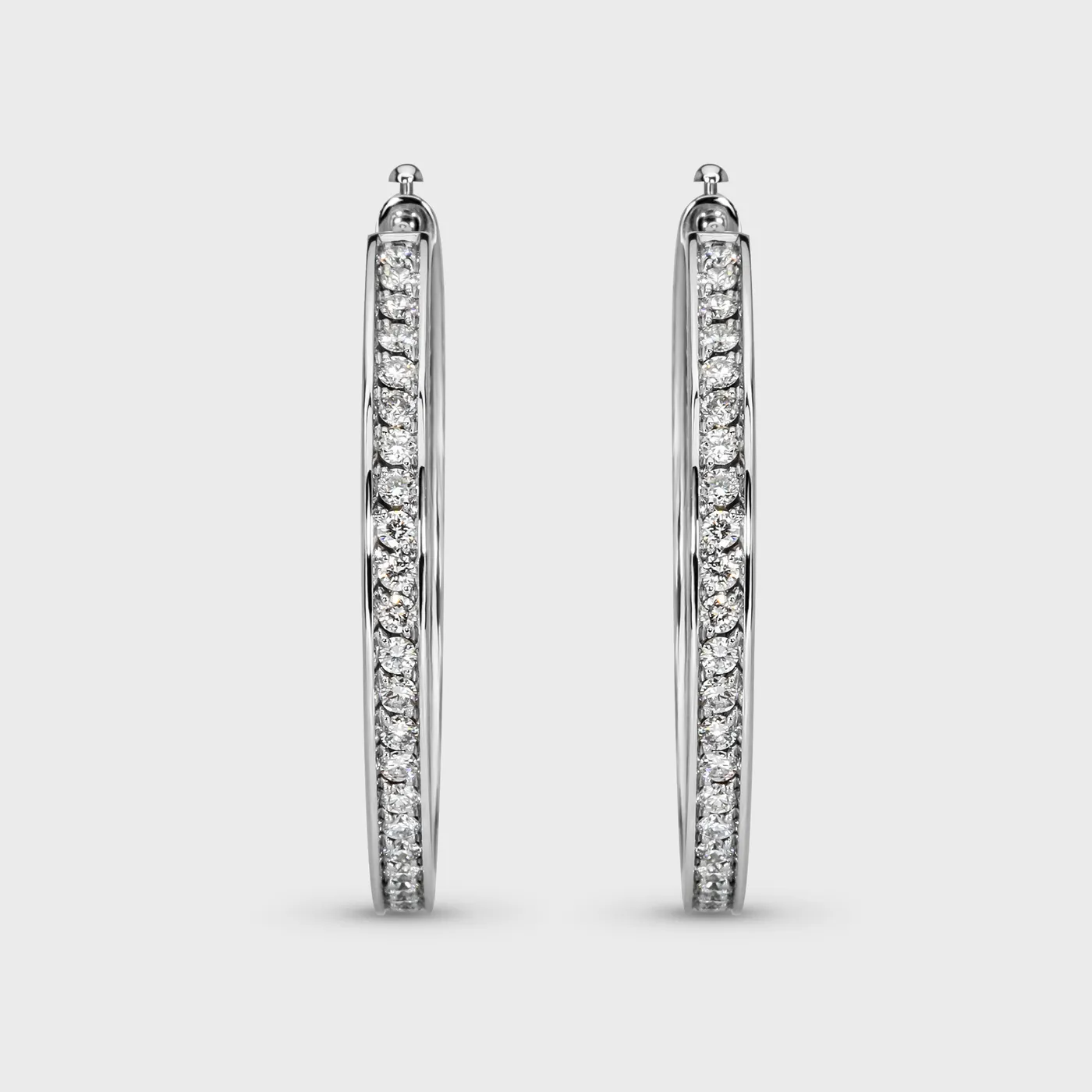 Chikalov white gold hoop earrings by ValeOro with a continuous line of diamonds that appear to float, front view