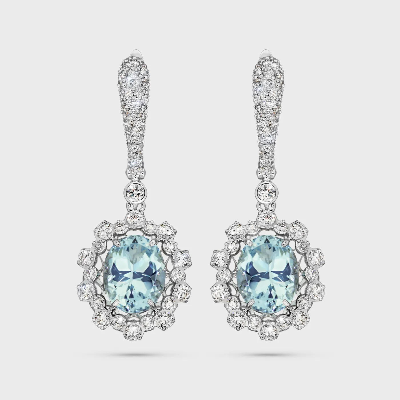 Salema white gold drop earrings by ValeOro with oval blue aquamarines in floral diamond halos, front view