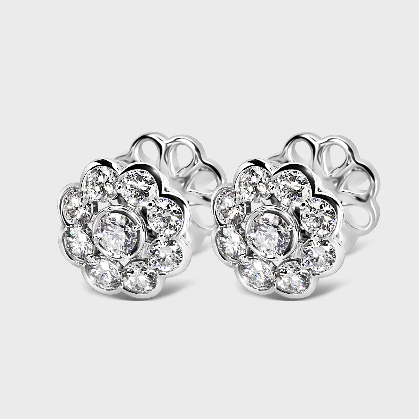 Amaryllis white gold diamond stud earrings by ValeOro in a floral cluster design, three-quarter view