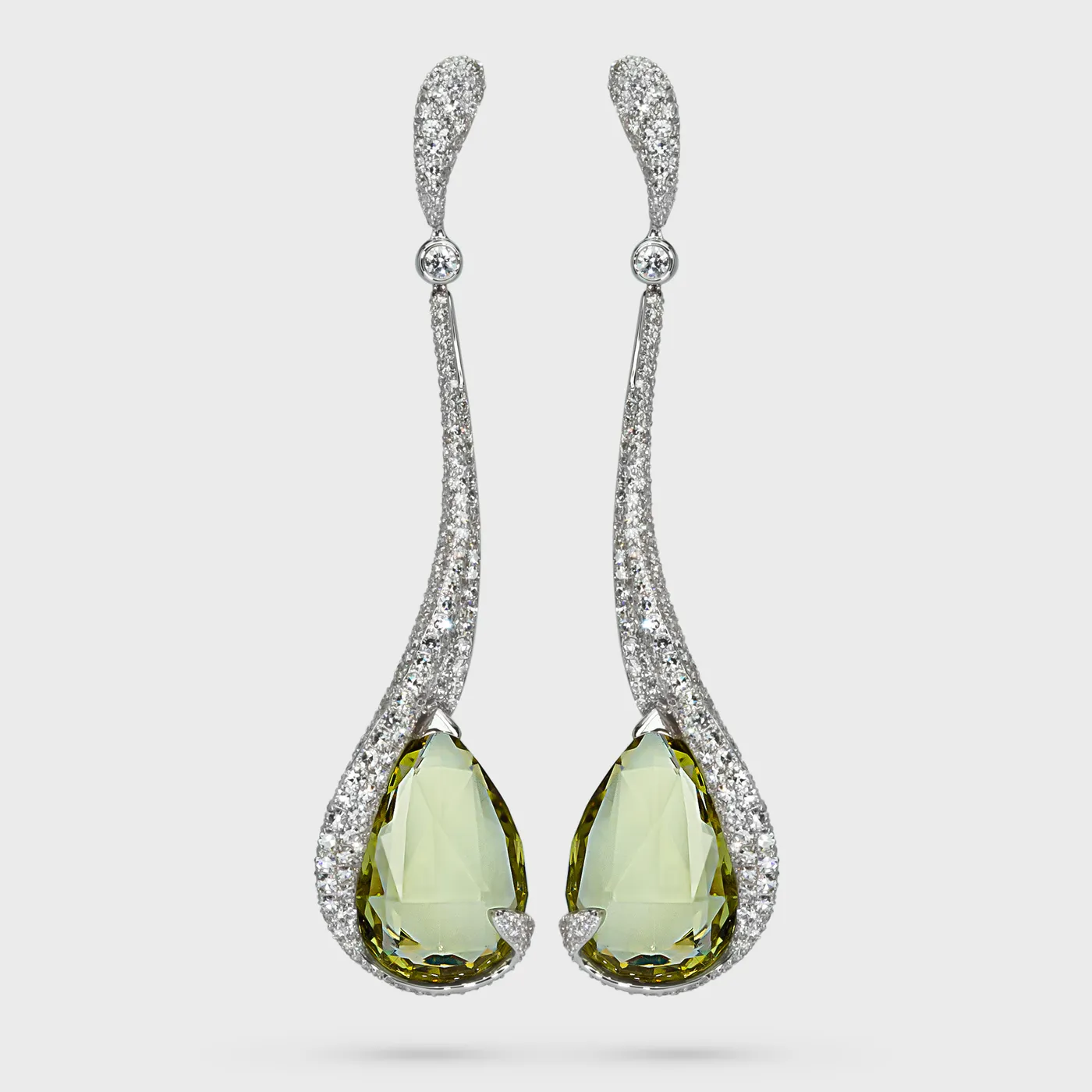 Anyos white gold earrings by ValeOro with pear-shaped golden-green heliodors framed by diamond pavé, front view