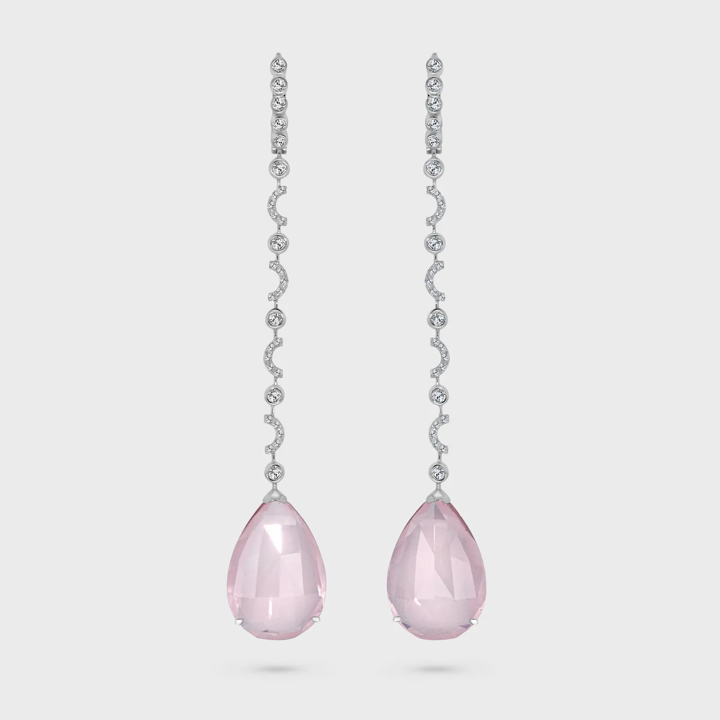 Soldeu white gold earrings by ValeOro with pear-shaped rose quartz drops and a line of bezel-set diamonds, front view