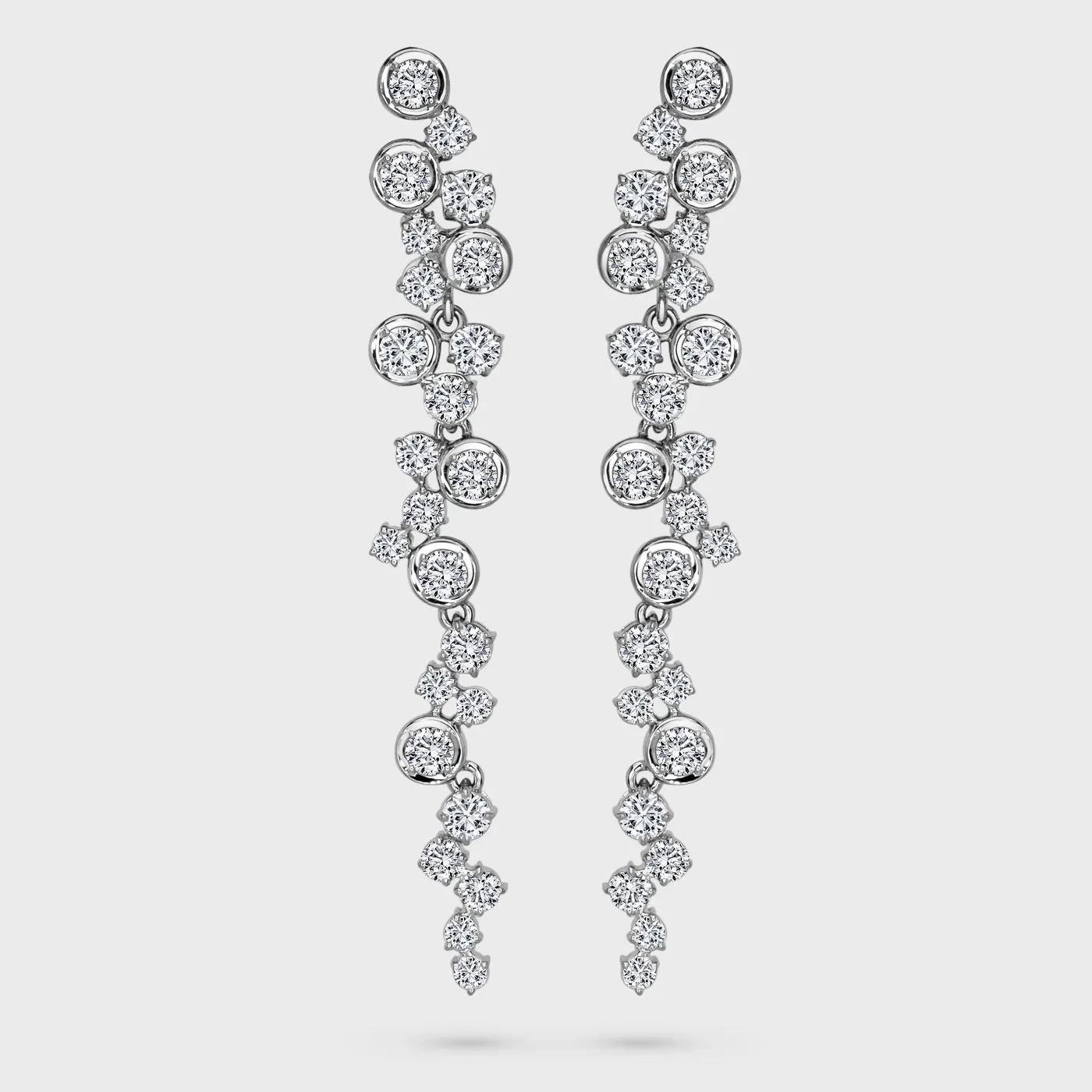 Clusters white gold drop earrings by ValeOro with round diamonds cascading in articulated clusters, front view