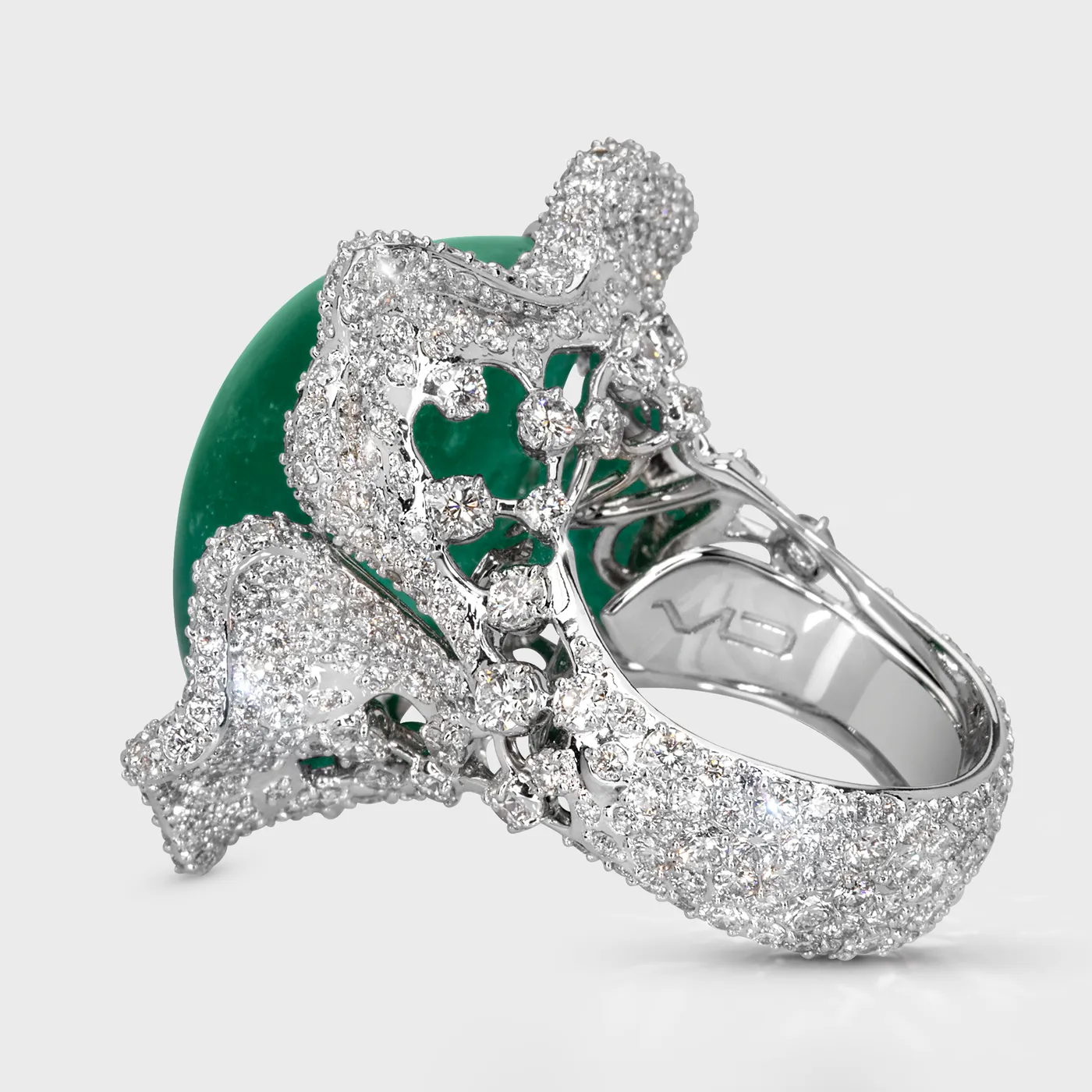 Crown of Ural white gold ring by ValeOro showing the openwork diamond gallery and emerald in profile, side view