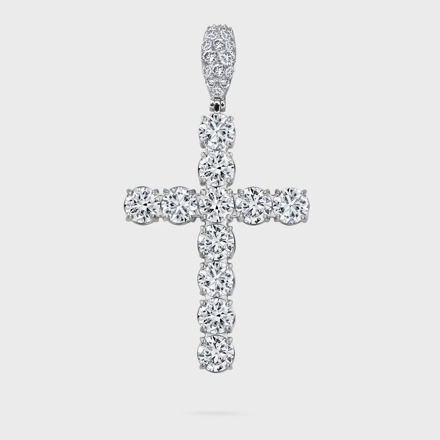 Gloss white gold cross pendant by ValeOro with large round diamonds and a pavé bail, front view