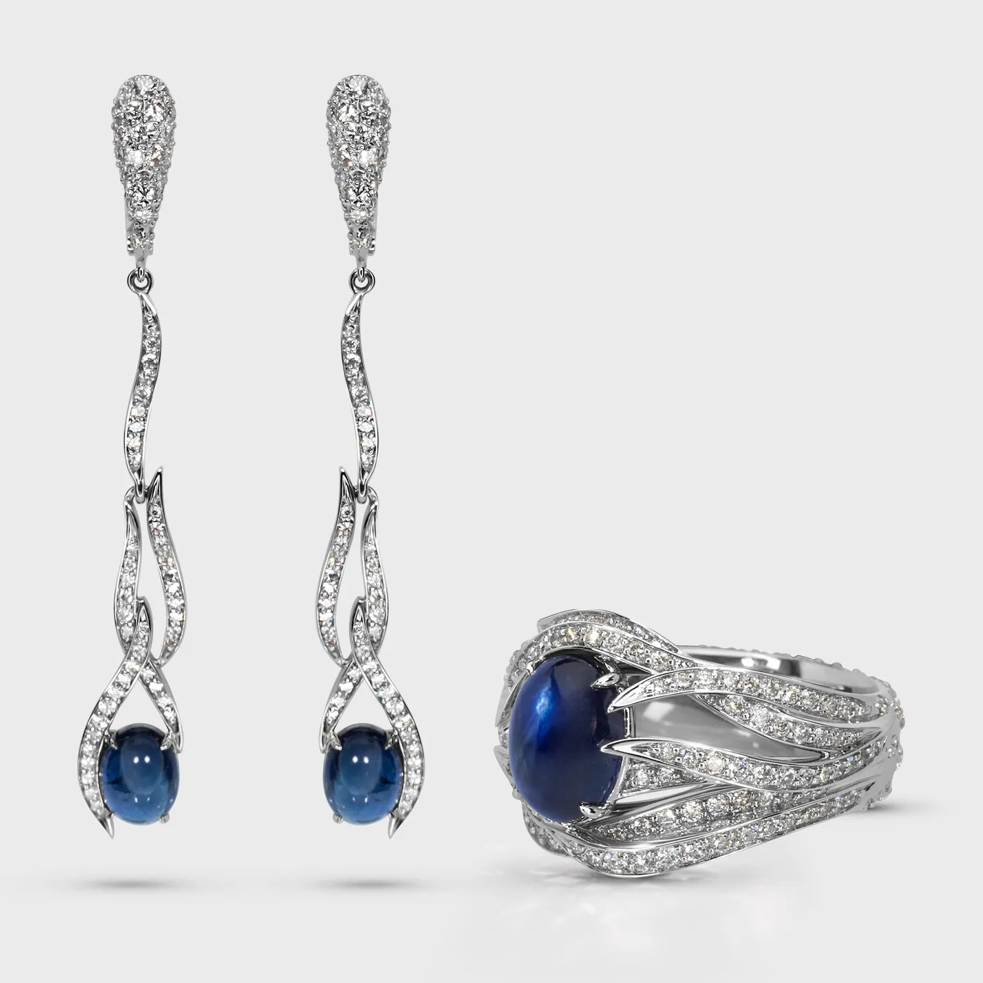Astraea white gold set by ValeOro with blue cabochon sapphires and diamonds, ring and earrings together