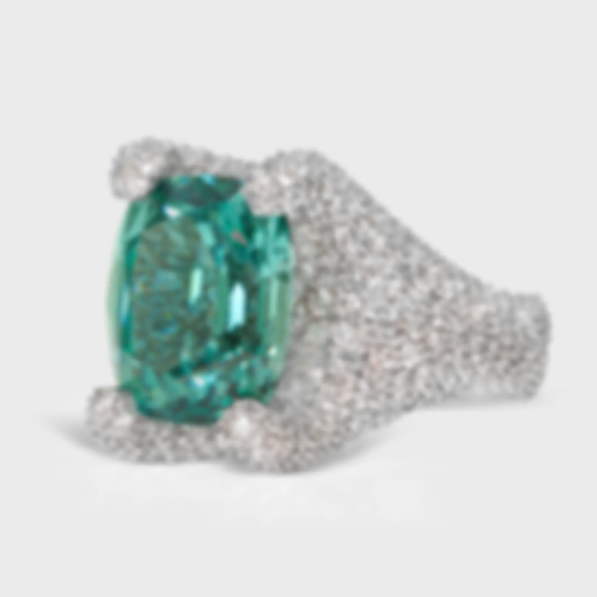 Granada Lagoon white gold ring by ValeOro with a blue-green tourmaline held by diamond-covered prongs, three-quarter view