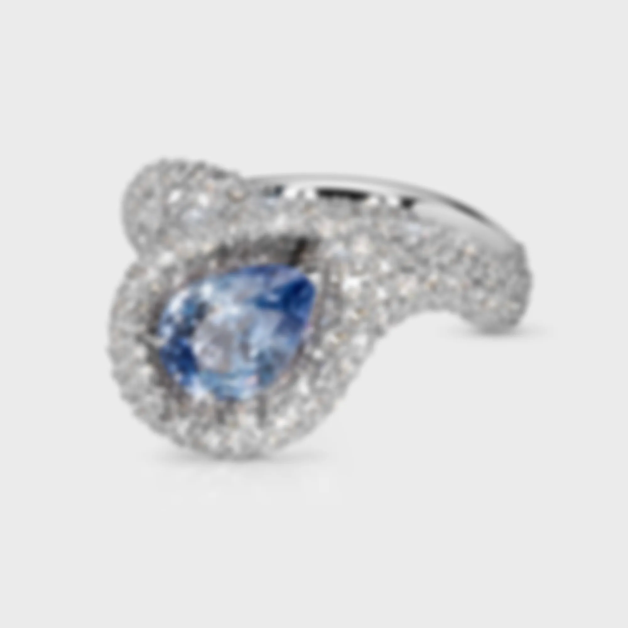 Yin-Yang Sapphire white gold ring by ValeOro with a pear-shaped pale blue sapphire framed by pavé diamonds, front view
