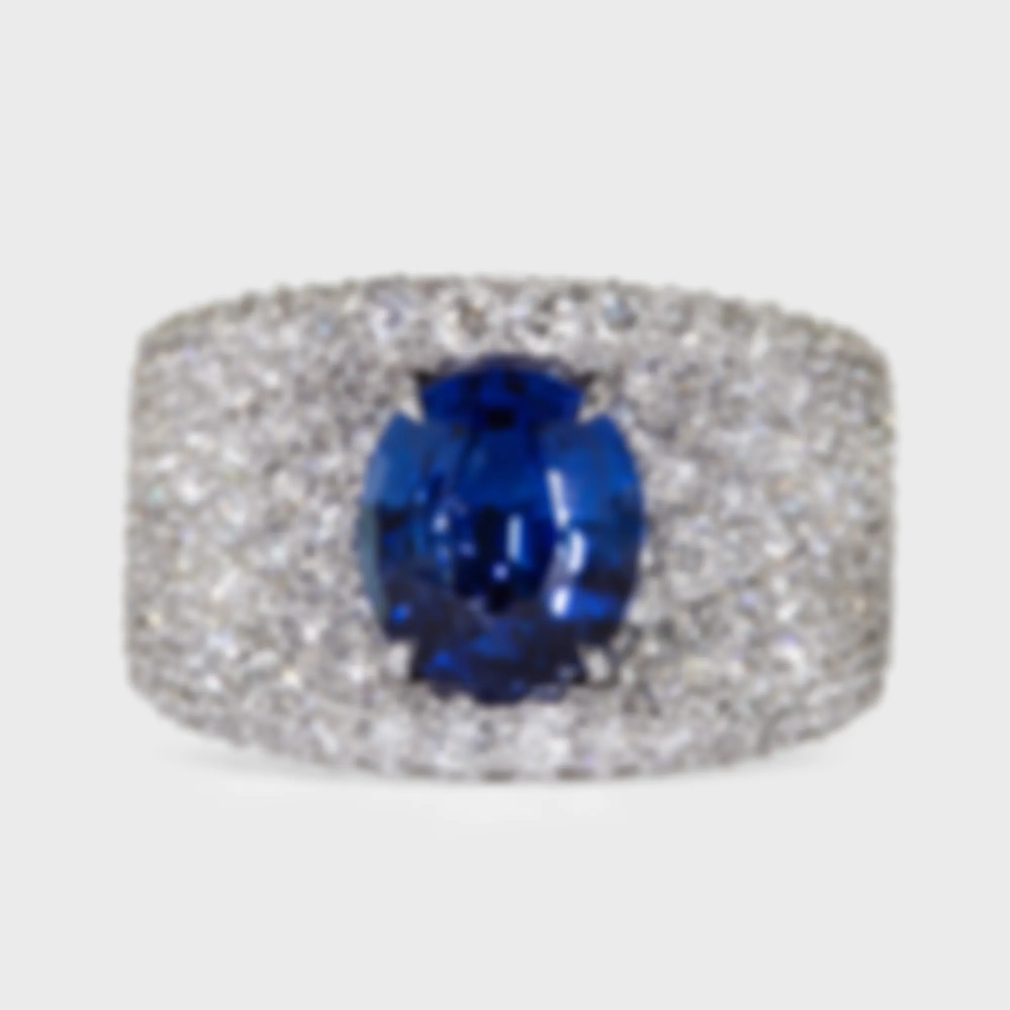 La Massana white gold ring by ValeOro with an oval blue sapphire set in full diamond pavé, front view