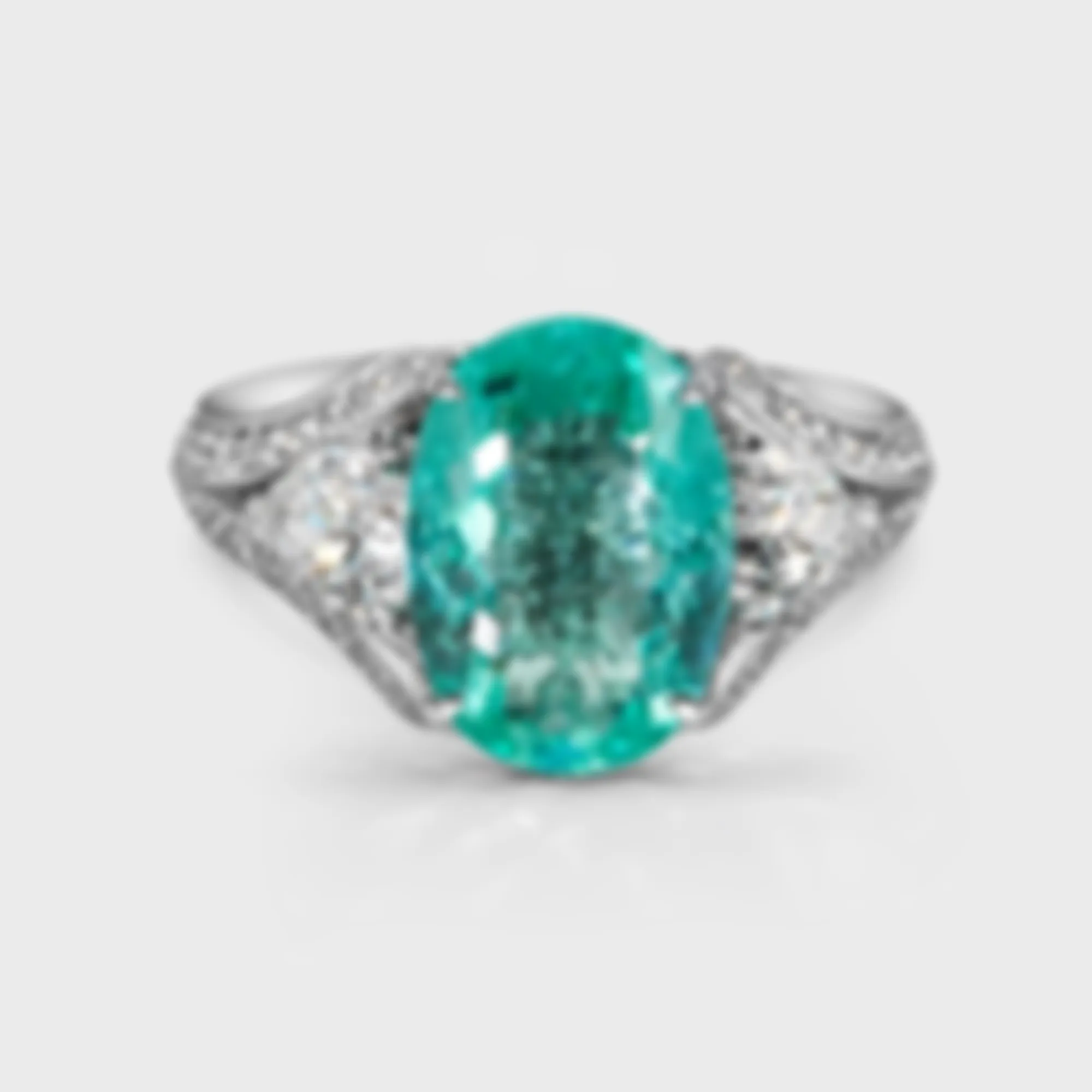 Laguna Paraiba white gold ring by ValeOro with an oval neon-green Paraiba tourmaline flanked by white diamonds, front view