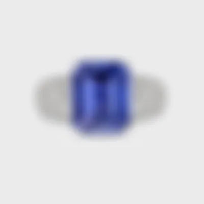 Sorteny Tanzanite white gold ring by ValeOro with an emerald-cut blue-violet tanzanite and diamond shoulders, front view