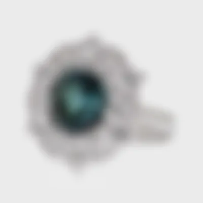 Gemstones Star white gold ring by ValeOro with an oval teal tourmaline in a star-shaped diamond halo, three-quarter view