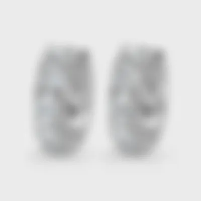 Gloss white gold hoop earrings by ValeOro set with round diamonds along the front, three-quarter view