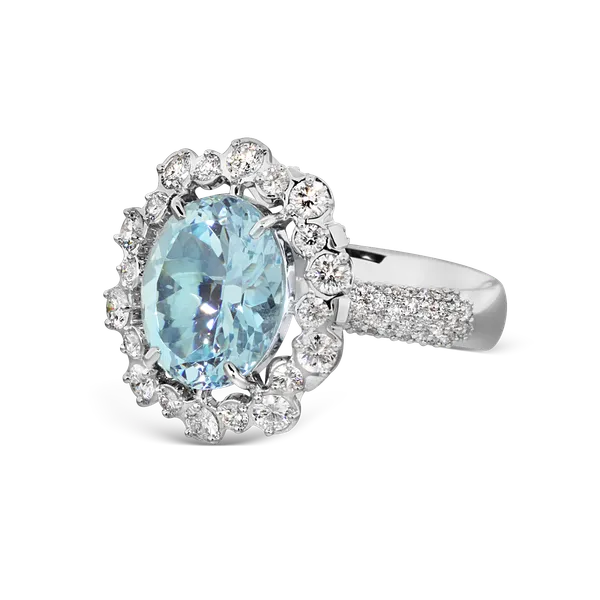 Salema white gold ring by ValeOro with a light-blue aquamarine in a diamond halo and pavé band, three-quarter view