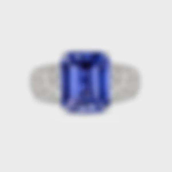 Sorteny Tanzanite white gold ring by ValeOro with an emerald-cut blue-violet tanzanite and diamond shoulders, front view