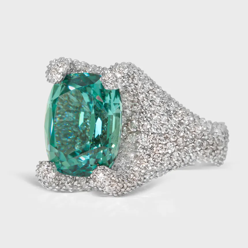 Granada Lagoon white gold ring by ValeOro with a blue-green tourmaline held by diamond-covered prongs, three-quarter view