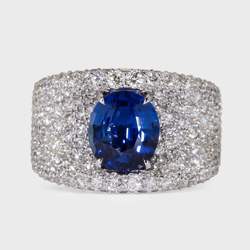 La Massana white gold ring by ValeOro with an oval blue sapphire set in full diamond pavé, front view