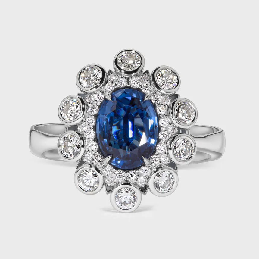 Nautico white gold ring by ValeOro with an oval blue sapphire framed by diamonds, front view