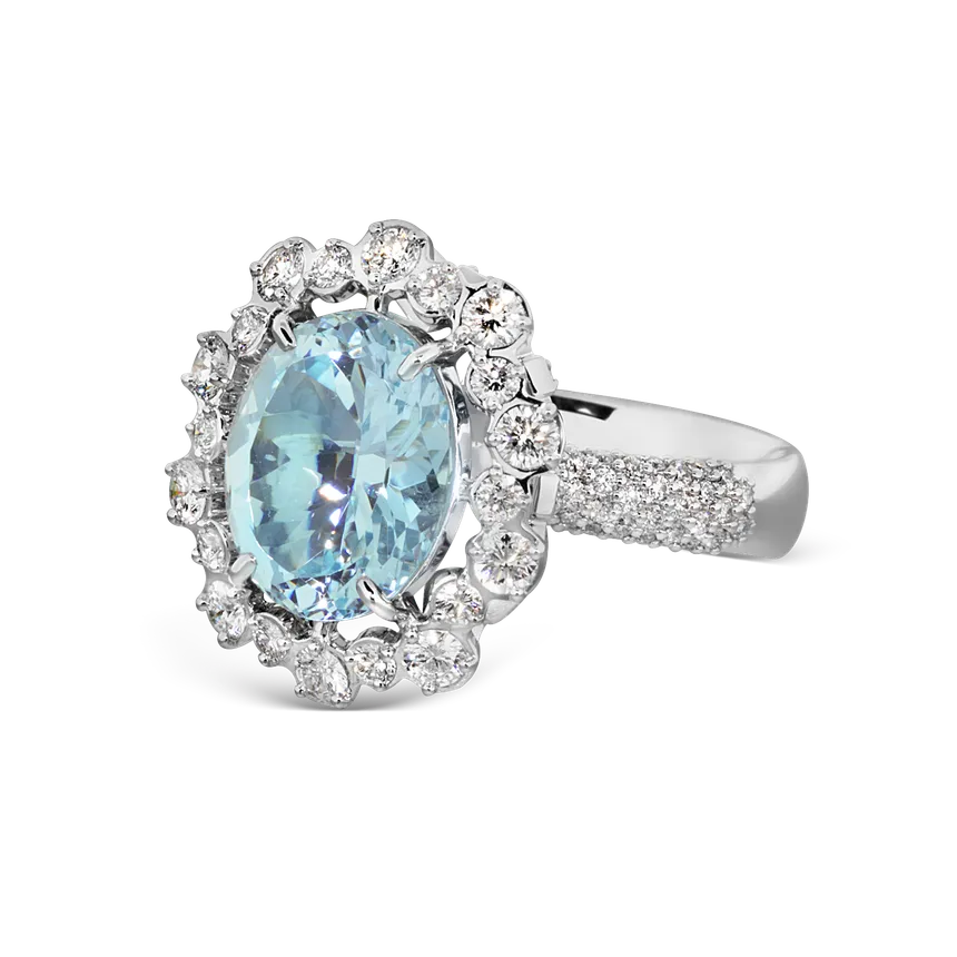 Salema white gold ring by ValeOro with a light-blue aquamarine in a diamond halo and pavé band, three-quarter view