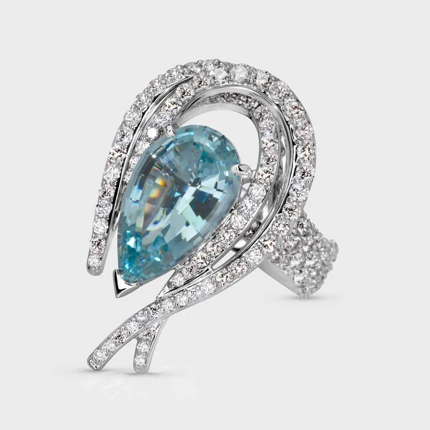 Vermont white gold ring by ValeOro with a pear-shaped blue aquamarine in a swirl of diamonds, front view