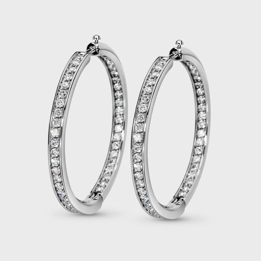 Chikalov white gold hoop earrings by ValeOro with diamonds set along the outer and inner sides, three-quarter view
