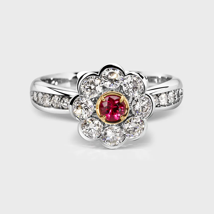 Amaryllis white gold ring by ValeOro with a round red spinel in a yellow gold setting, framed by a diamond flower, front view